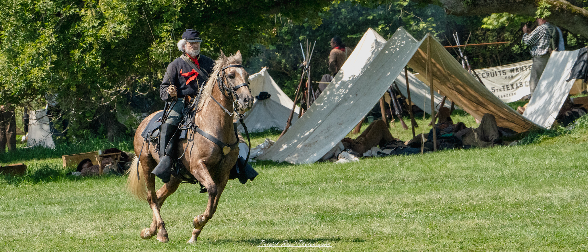 A cavalry soldier galloping on horseback, brandishing a saber in one hand while steering the horse with the other. Dressed in a period uniform, the soldier's focused expression and dynamic pose highlight the intensity and mobility of cavalry combat.